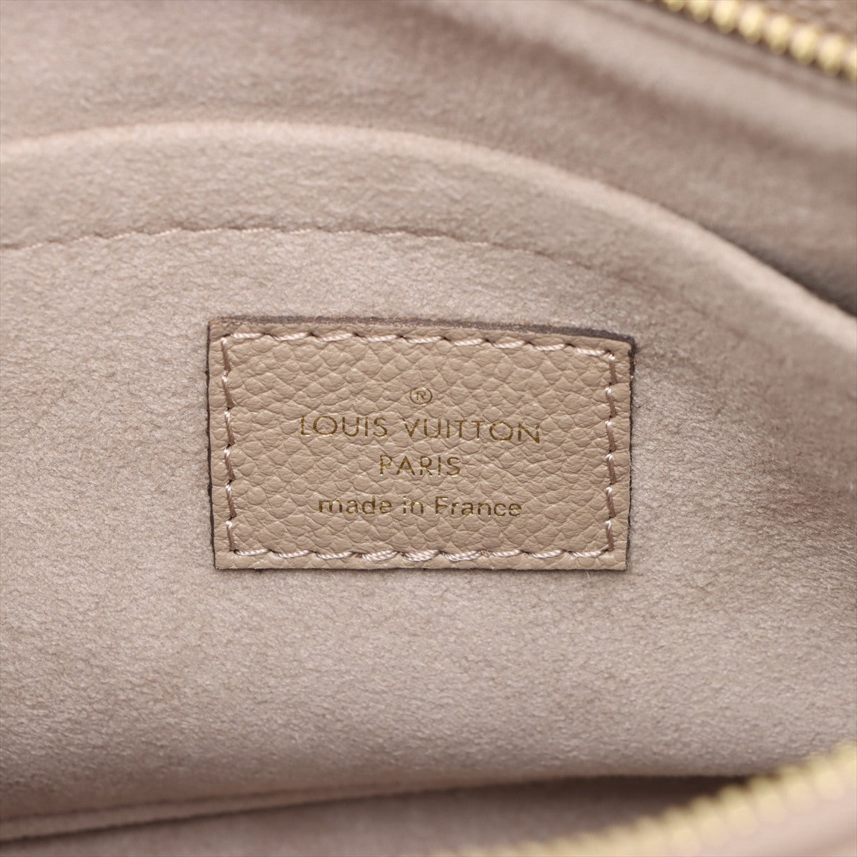 Onthego Leder East West Empreinte Tote Handtasche Taupe 