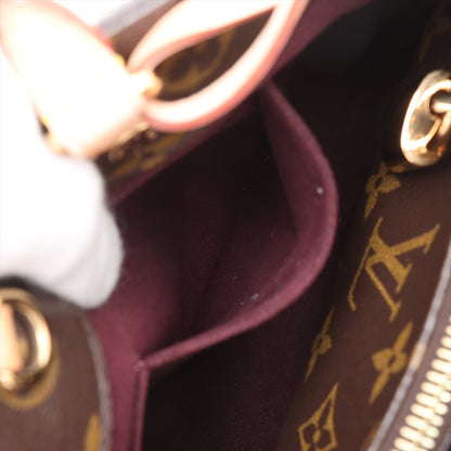 Bolsa Montaigne BB Monogram de lona com alça de mão 