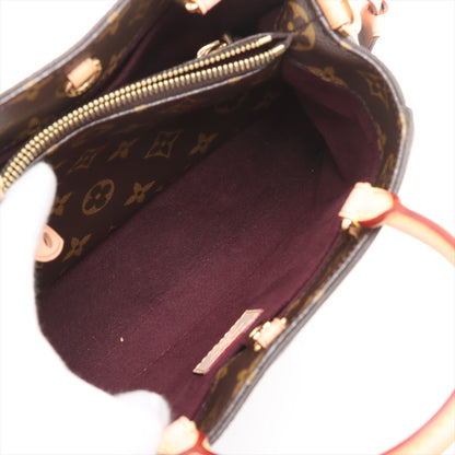 Bolsa Montaigne BB Monogram de lona com alça de mão 