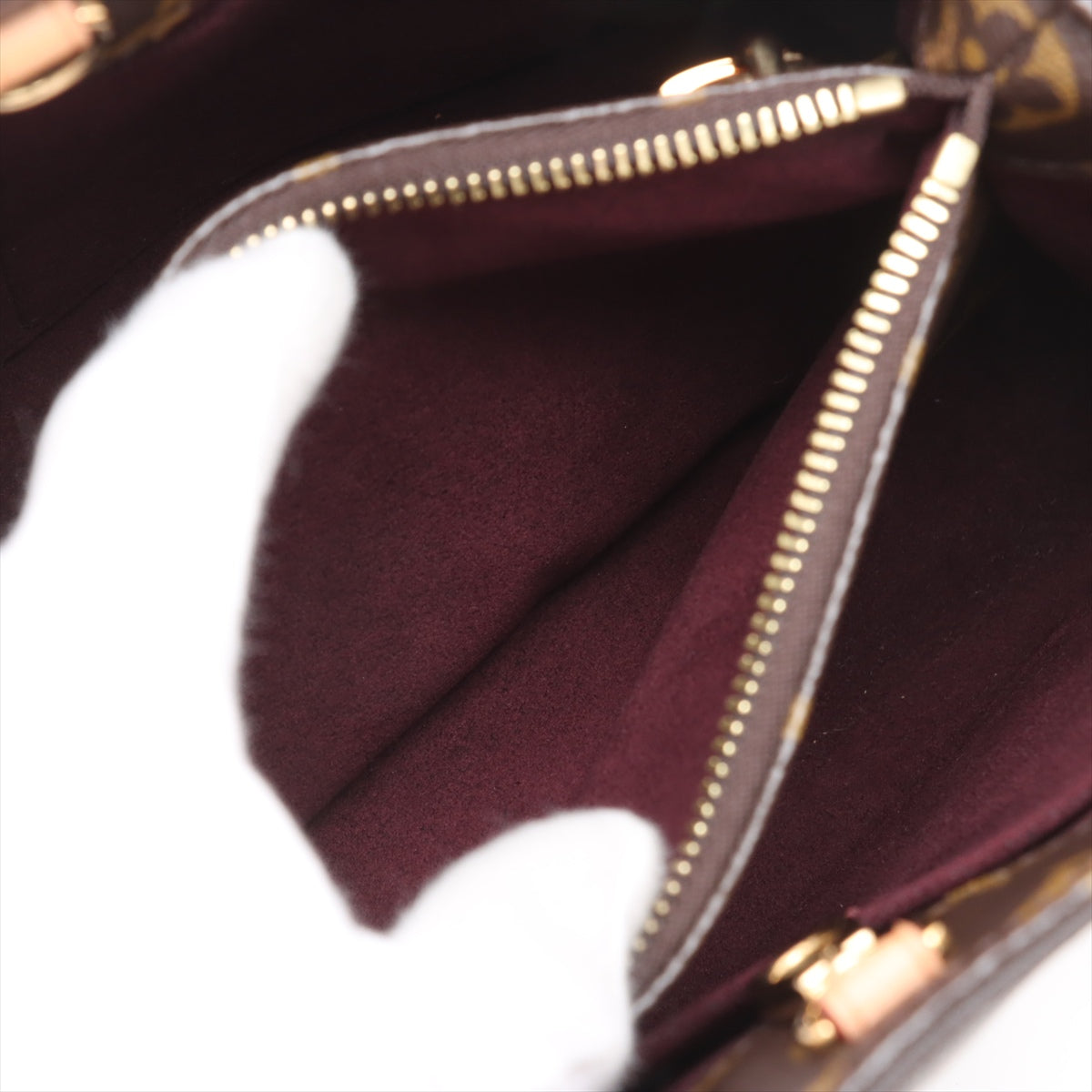 Bolsa Montaigne BB Monogram de lona com alça de mão 