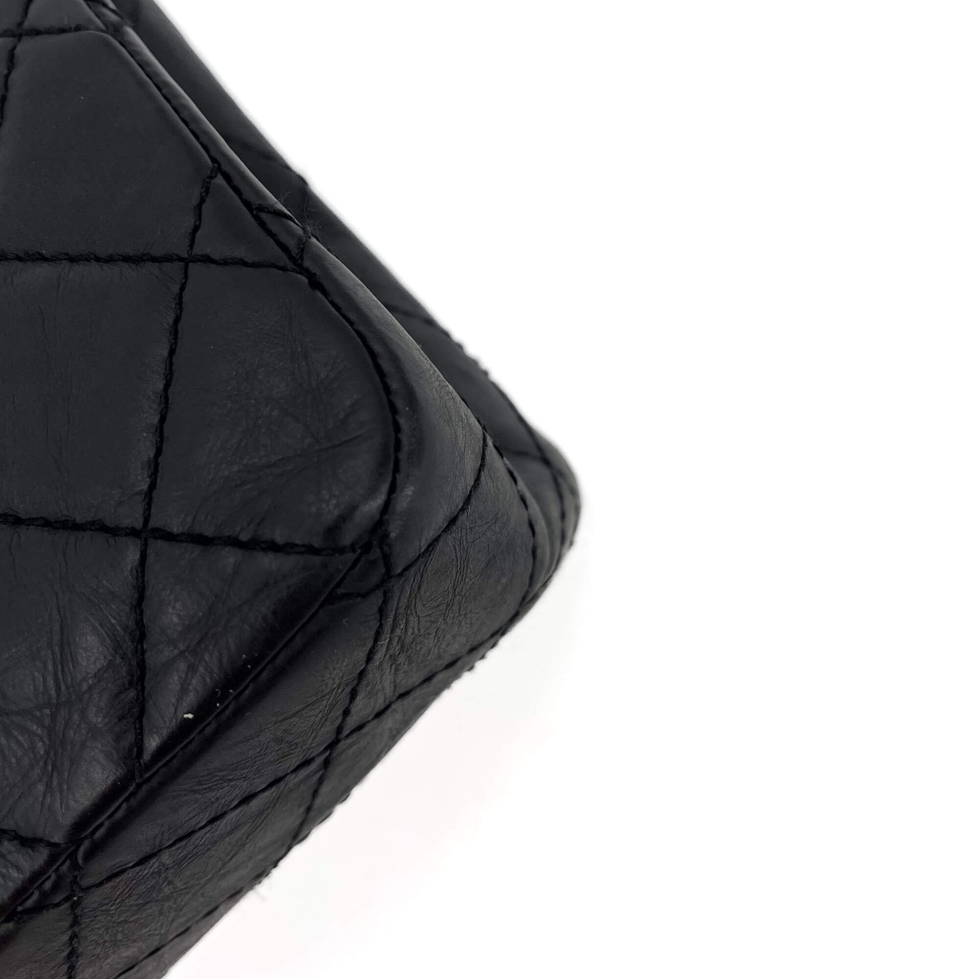 Second hand Chanel 2.55 Reissue Maxi Matelassè Lambskin Leather 2 - Ways Flap Bag Black - Tabita Bags