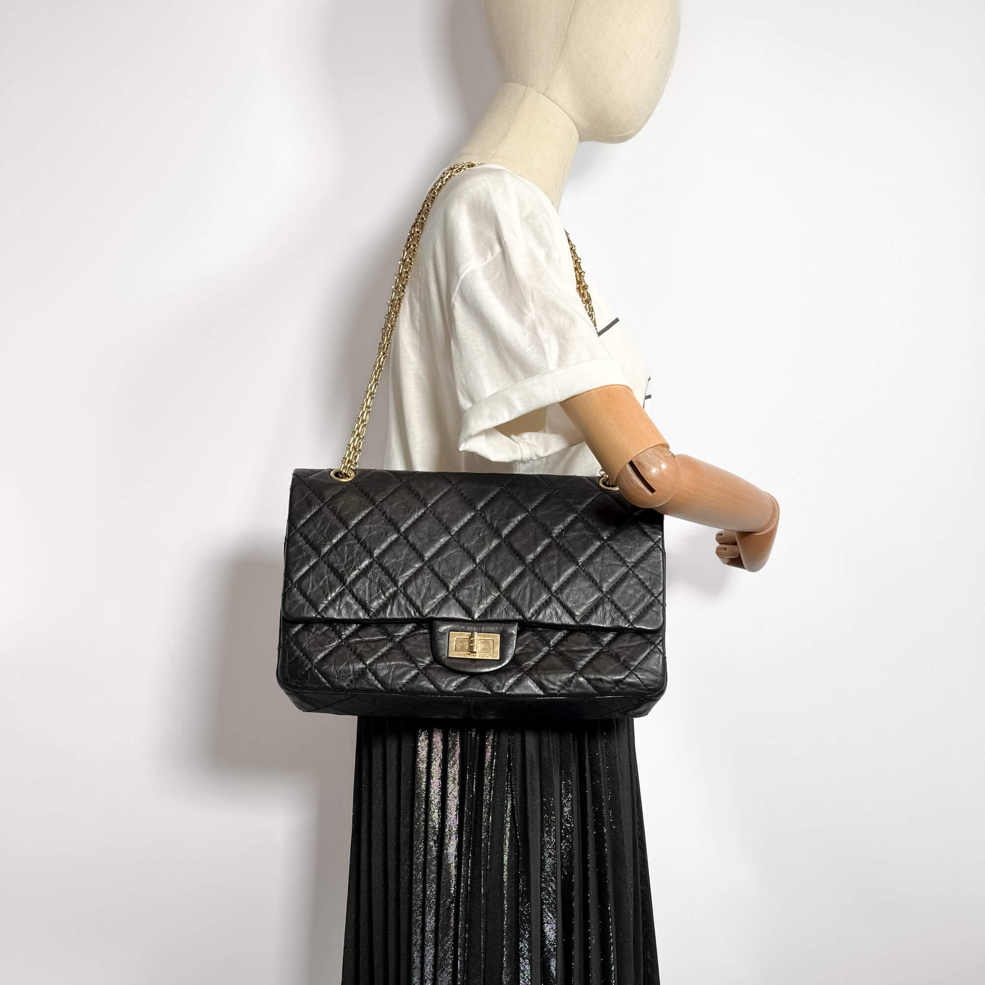 Second hand Chanel 2.55 Reissue Maxi Matelassè Lambskin Leather 2 - Ways Flap Bag Black - Tabita Bags