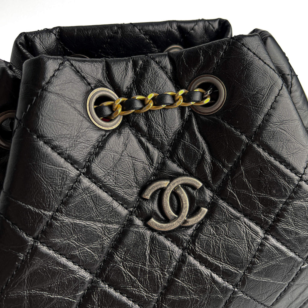 Second hand Chanel Gabrielle Matelassè Distressed Calfskin Leather 2 - Ways Bucket Backpack Black - Tabita Bags