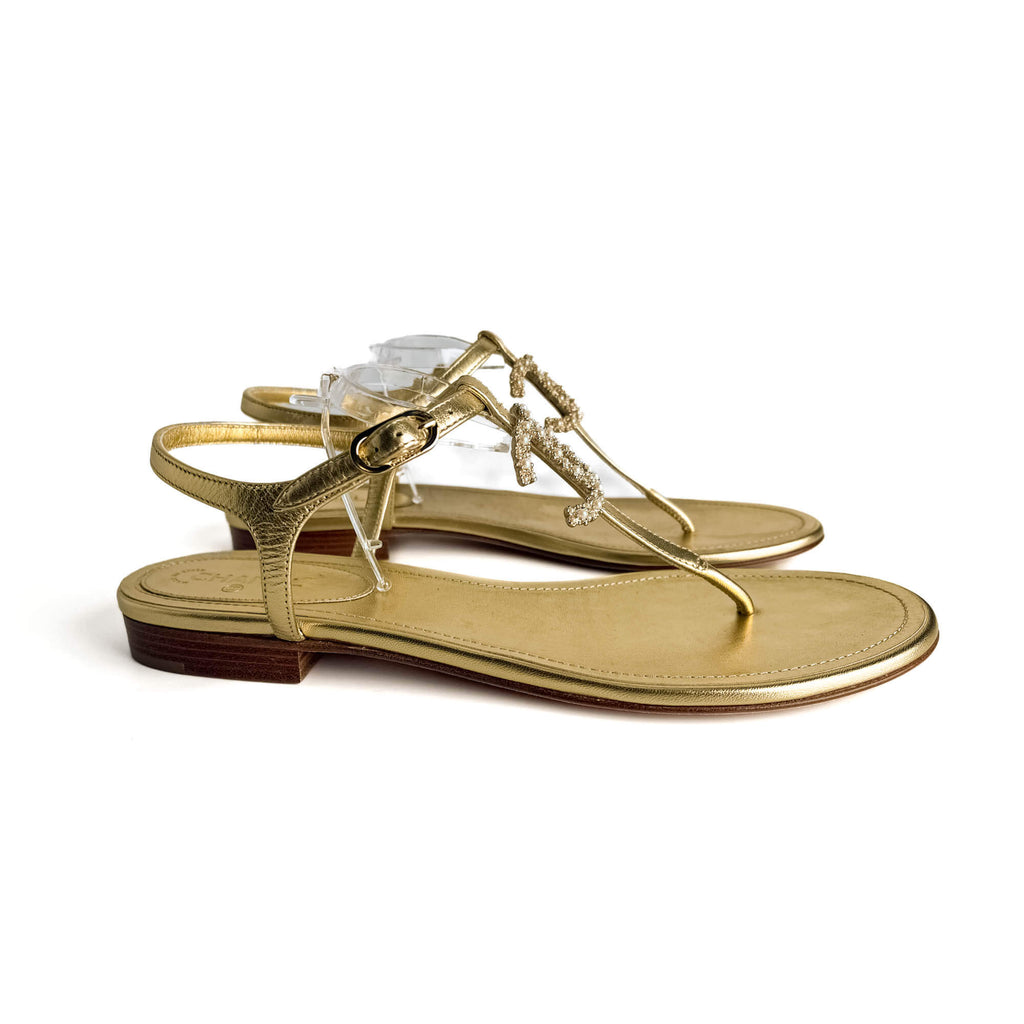 Second hand Chanel T - strap Tong Leather Sandals Gold - Tabita Bags