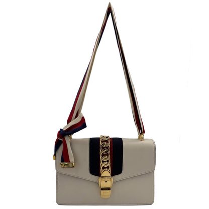 Second hand Gucci Sylvie Small Calf leather Leather 2 - Ways Flap Bag with detachable Web shoulder strap. Off - white - Tabita Bags