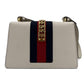 Second hand Gucci Sylvie Small Calf leather Leather 2 - Ways Flap Bag with detachable Web shoulder strap. Off - white - Tabita Bags