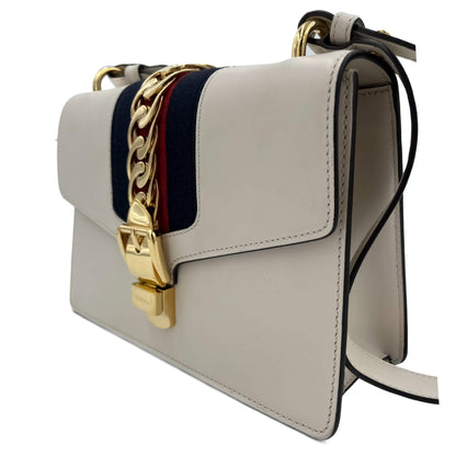 Second hand Gucci Sylvie Small Calf leather Leather 2 - Ways Flap Bag with detachable Web shoulder strap. Off - white - Tabita Bags