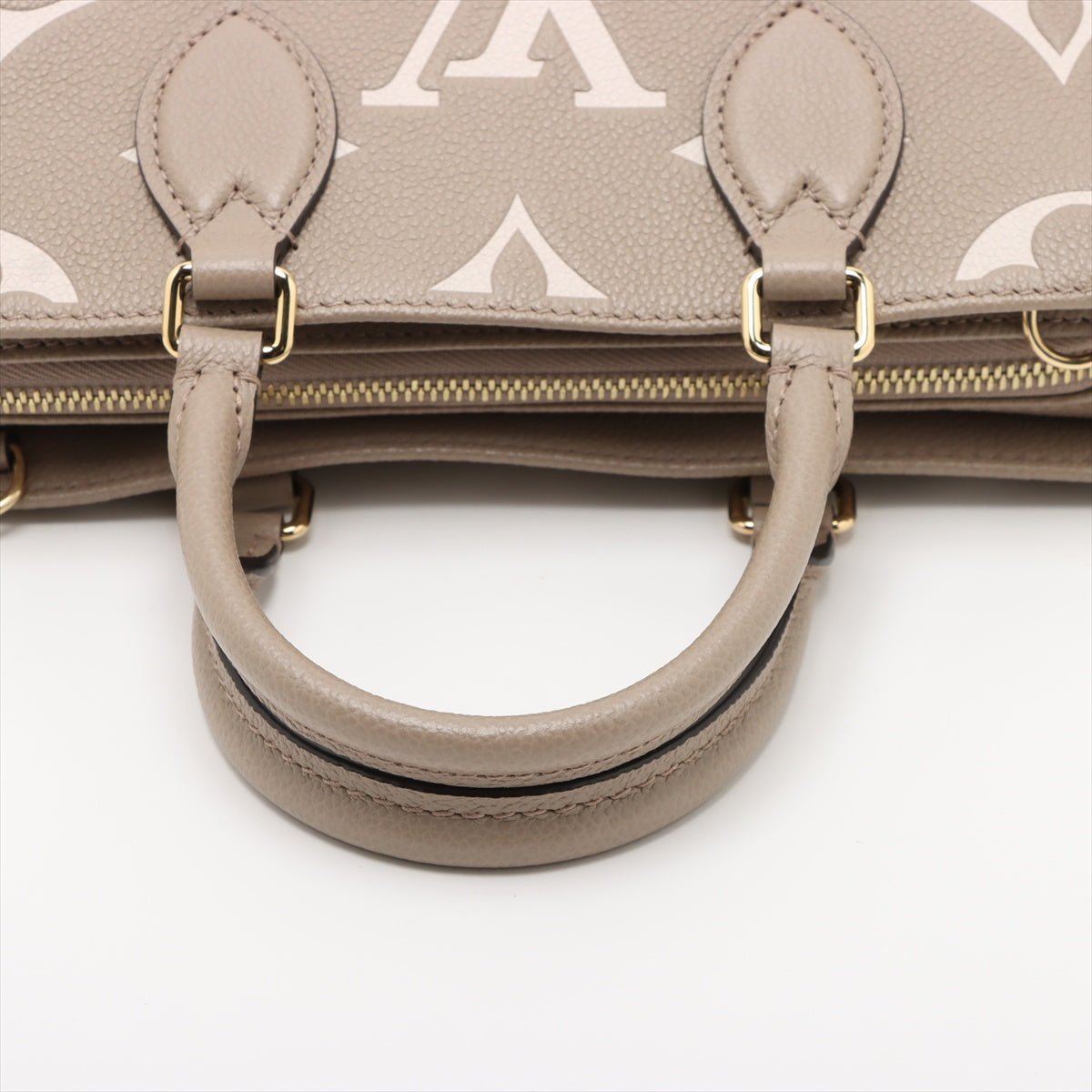Second hand Louis Vuitton Onthego Leather East West Empreinte Tote Handbag Taupe - Tabita Bags