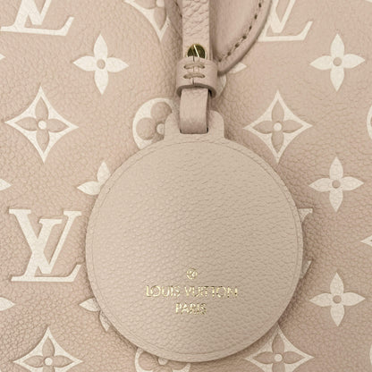 Second hand Louis Vuitton Onthego MM Spring in the City Empreinte Leather Tote Bag Beige - Tabita Bags