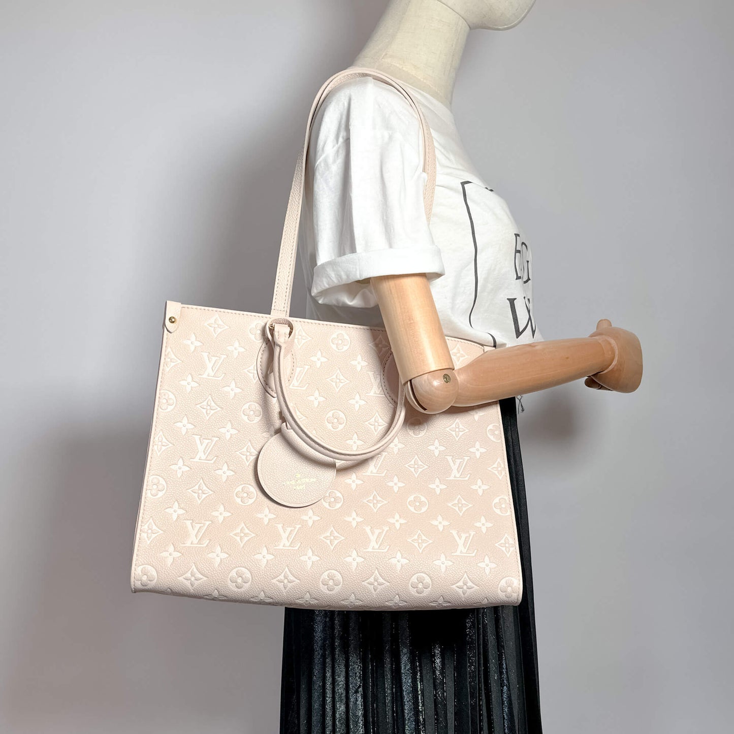 Second hand Louis Vuitton Onthego MM Spring in the City Empreinte Leather Tote Bag Beige - Tabita Bags