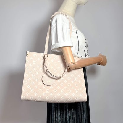 Second hand Louis Vuitton Onthego MM Spring in the City Empreinte Leather Tote Bag Beige - Tabita Bags