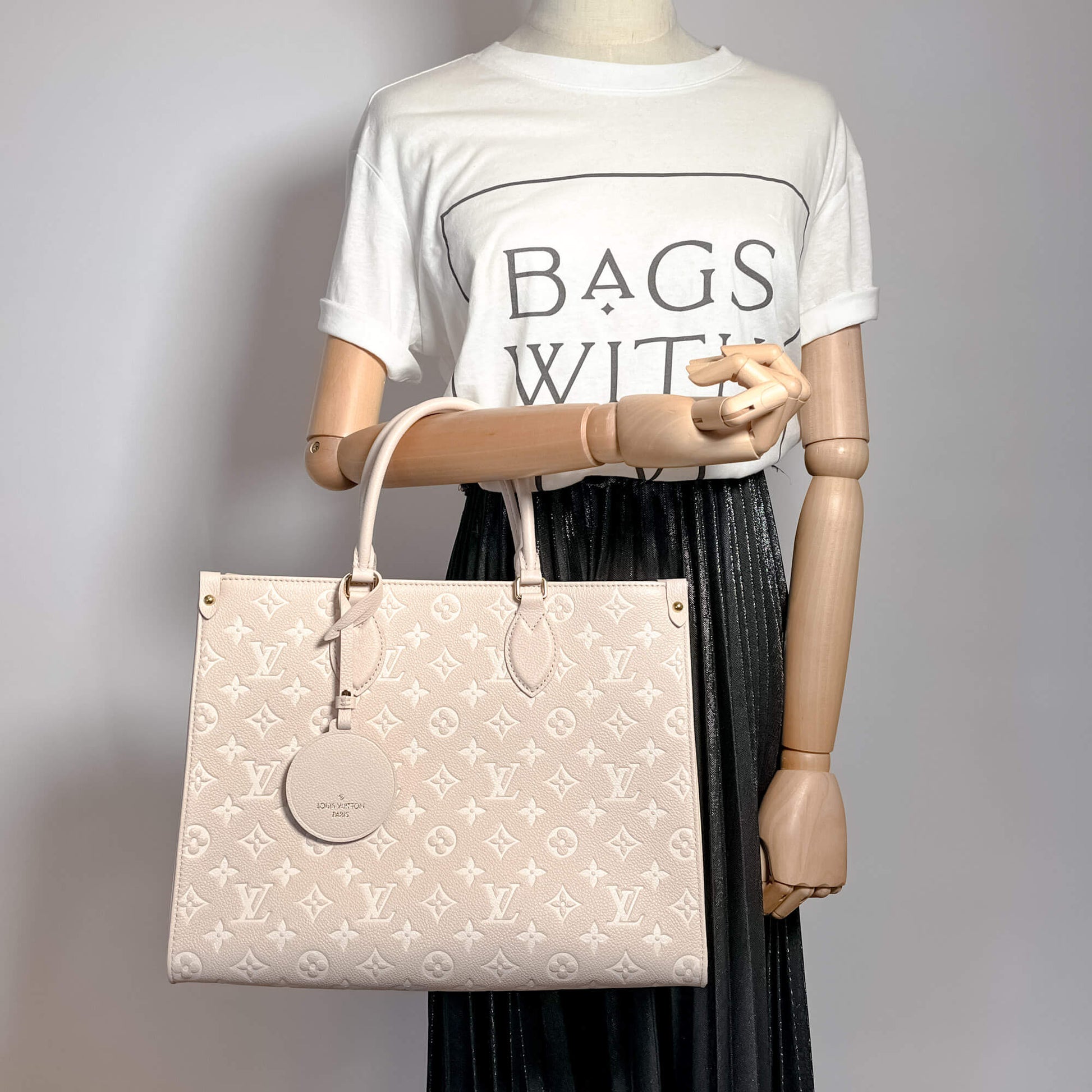 Second hand Louis Vuitton Onthego MM Spring in the City Empreinte Leather Tote Bag Beige - Tabita Bags