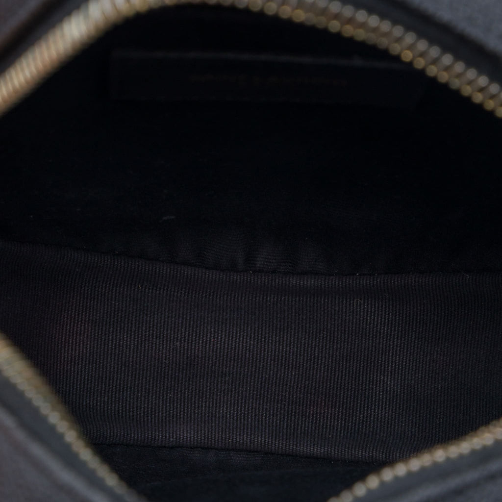 Second hand Saint Laurent Vinyle Grained Calfskin Leather Round Chevron Quilted Camera Crossbody Black - Tabita Bags
