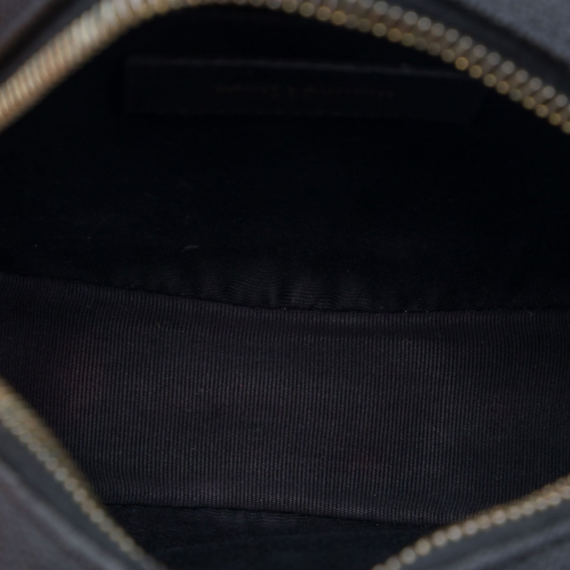 Second hand Saint Laurent Vinyle Grained Calfskin Leather Round Chevron Quilted Camera Crossbody Black - Tabita Bags