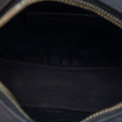 Second hand Saint Laurent Vinyle Grained Calfskin Leather Round Chevron Quilted Camera Crossbody Black - Tabita Bags